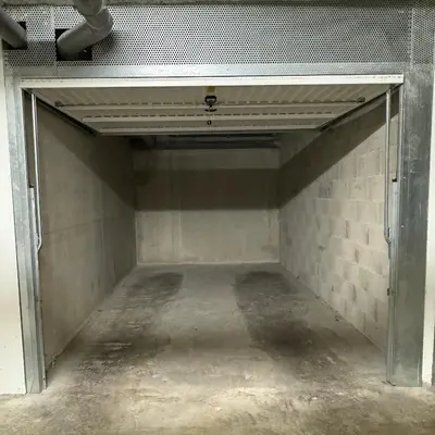 an empty garage with the door open in a building at Top Floor Secret Garden, Cannes in Cannes