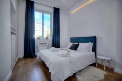 a bedroom with a bed with two towels on it at Elégant 2 chambres PARKING, Clémenceau- CENTRE CANNES A2B248 in Cannes