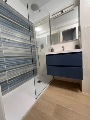 a bathroom with a sink and a shower at La Perla del Mare in Cannes