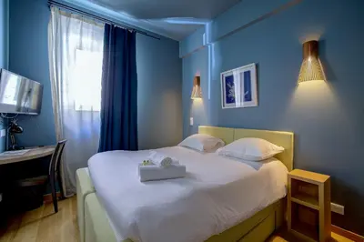 a bedroom with a bed with a box on it at Superbe appartement T5 proche du Palais et de la Croisette in Cannes