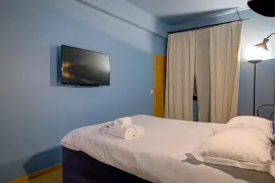 a bedroom with a bed with towels on it at Superbe appartement T5 proche du Palais et de la Croisette in Cannes