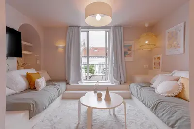 a living room with a couch and a table at Alma Florian apartment 4 people with terrace in Cannes