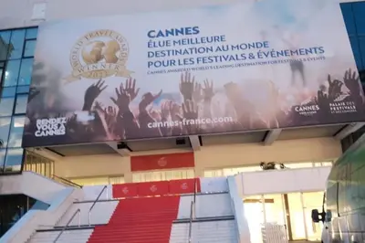 a banner on the side of a building with a red carpet at Studio Cannes - 5mn Palais des Festivals (400m) in Cannes