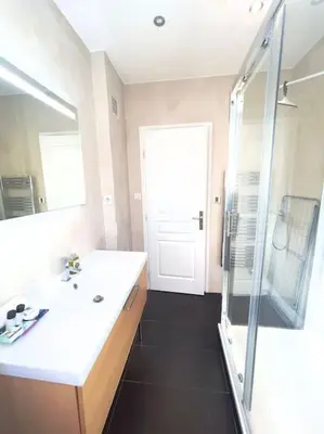 a bathroom with a white sink and a shower at Le Canada - 2Pièces Croisette plage derrière le Carlton calme in Cannes