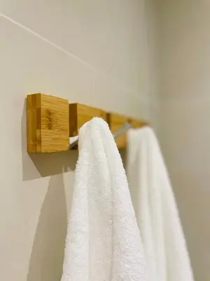 a towel rack with white towels hanging on it at Le Week Riviera III -3 étoiles-Plage du midi-Grande terrasse-Piscine-Cannes- Palais des Festivals in Cannes