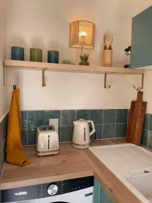 a kitchen with a counter top with appliances on it at Le Week Riviera III -3 étoiles-Plage du midi-Grande terrasse-Piscine-Cannes- Palais des Festivals in Cannes