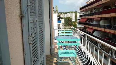a blue table and chairs on a balcony at B042-Functional apartment with balcony Suquet Cannes in Cannes