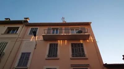 a building with a balcony on the side of it at B042-Functional apartment with balcony Suquet Cannes in Cannes