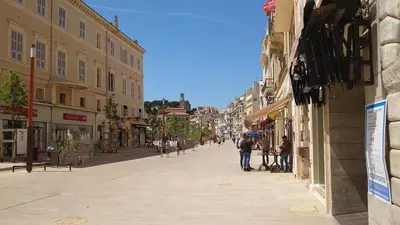 a city street with people walking down the street at B042-Functional apartment with balcony Suquet Cannes in Cannes