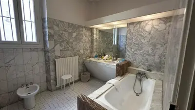 a bathroom with a tub and a sink and a toilet at B011-Appartement familial - Proche de la plage in Cannes