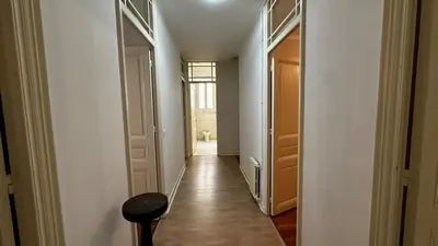 an empty hallway with a hallway leading to a room at B011-Appartement familial - Proche de la plage in Cannes