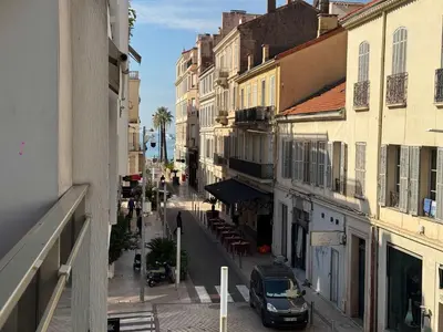a city street with buildings and a car parked on the street at B057-Beau studio Carré D'Or & Proche de la Mer Cannes in Cannes