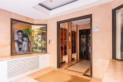 an empty room with glass doors in a building at Upscale 3-room apartment 300m from the beaches in Cannes