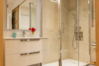 a bathroom with a sink and a shower at Upscale 3-room apartment 300m from the beaches in Cannes