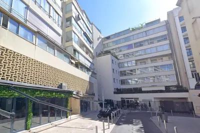 a street in a city with tall buildings at Mini-Studio Le Cormoran By SCLS Locations in Cannes