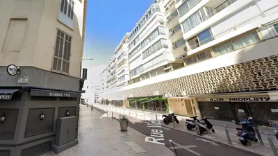 a street with motorcycles parked in front of buildings at Mini-Studio Le Cormoran By SCLS Locations in Cannes