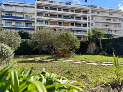a building with a garden in front of a building at Les Jardins de Lérins By SCLS Locations in Cannes