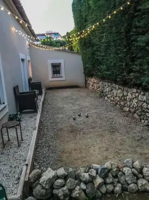 a group of ducks in a yard with lights at 10mn de Cannes, villa entière de 150m2. in Le Cannet