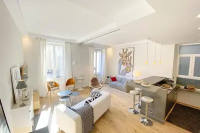 a living room with a couch and a table at Beautiful 2 bedrooms 2 bathrooms Center of Cannes in Cannes