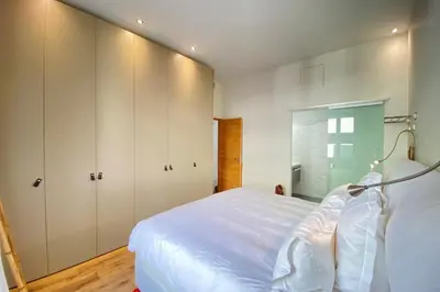 a bedroom with a large bed and white cabinets at Beautiful 2 bedrooms 2 bathrooms Center of Cannes in Cannes