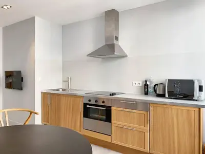 a kitchen with a stove and a microwave at BAT2 - Cannes, Carré d'Or, beau 2 pièces in Cannes