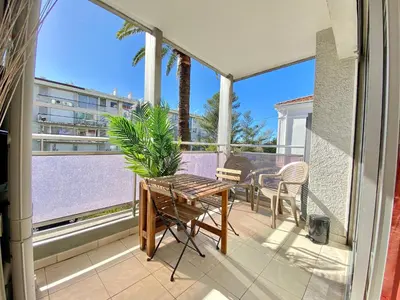 a patio with a table and chairs on a balcony at Terracotta - Proche Palais des Festivals - By SCLS Locations in Cannes