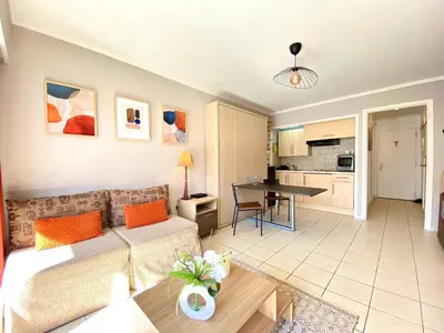a living room with a couch and a table at Terracotta - Proche Palais des Festivals - By SCLS Locations in Cannes