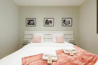 a bedroom with a bed with two towels on it at My Ty Croisette Martinez YourHostHelper in Cannes