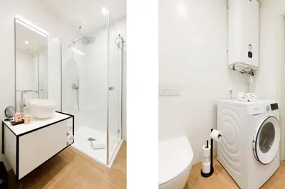 a white bathroom with a washing machine and a sink at My Ty Croisette Martinez YourHostHelper in Cannes