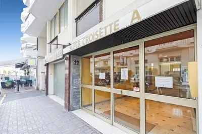 a store front with glass doors on a street at My Ty Croisette Martinez YourHostHelper in Cannes