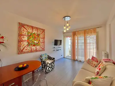 a living room with a couch and a table at Le Colony in Cannes