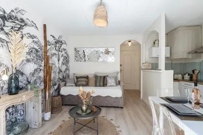 a kitchen and a bedroom with a bed in a room at Magnifique studio centre Cannes Vieux port-Croisette-Plages in Cannes