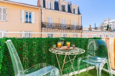 a table and two chairs sitting on a patio at Magnifique studio centre Cannes Vieux port-Croisette-Plages in Cannes