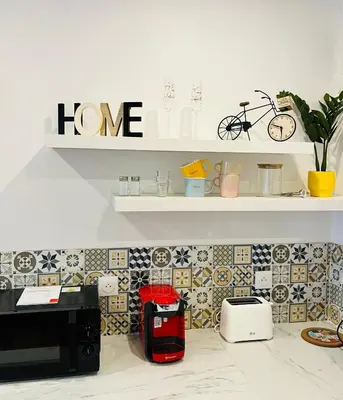 a kitchen with a washing machine in a kitchen at Luxury Studio à Cannes/Croisette in Cannes