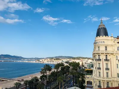 a view of a building and the ocean at Studio Cannes Croisette in Cannes