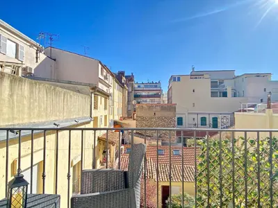 a view of a city from a balcony at Le 74 By SCLS Locations in Cannes