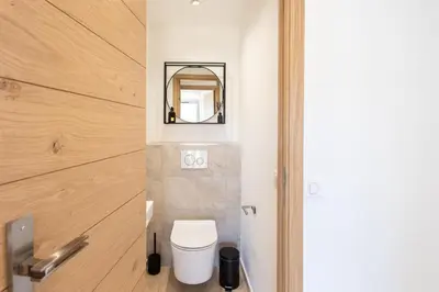 a bathroom with a toilet and a mirror at C7 - 1 BDR Pointe Croisette 5min Sea - Parking, AC & Terrace in Cannes