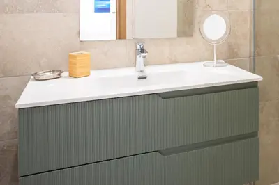 a bathroom with a sink and a mirror at C7 - 1 BDR Pointe Croisette 5min Sea - Parking, AC & Terrace in Cannes