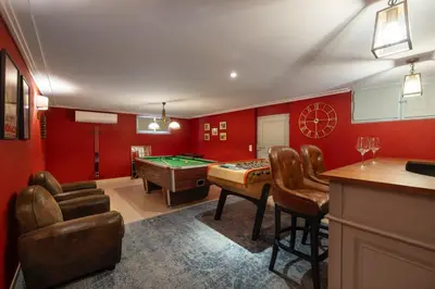 a red room with a pool table and a bar at REF 2135 - Cannes - Villa for rent in Cannes