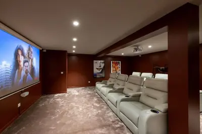 a living room with a couch and a flat screen tv at REF 2135 - Cannes - Villa for rent in Cannes