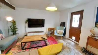 a living room with a couch and a table at Maison moderne centre-ville in Cannes