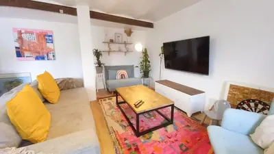a living room with a couch and a table at Maison moderne centre-ville in Cannes