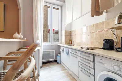 a kitchen with a sink and a dishwasher at L'Échappée Cannoise Forville in Cannes