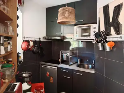 a small kitchen with a sink and a microwave at STUDIO VILLA VIANNEY in Cannes