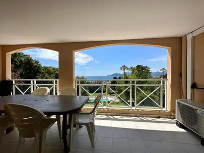 a dining room with a table and a large window at Villa FRANCIA bat Van Gogh in Cannes