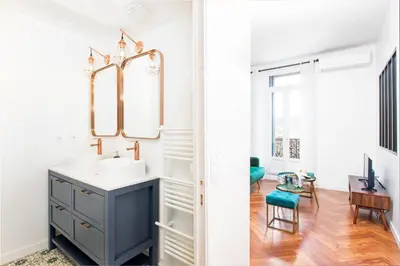 a bathroom with a sink and a mirror at 5mn Palais des festivals - Vue sur le Port - BS in Cannes