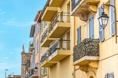a facade of a building with balconies and a street at 5mn Palais des festivals - Vue sur le Port - BS in Cannes