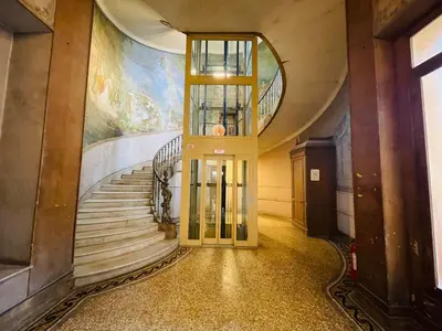 an elevator in a building with a spiral staircase at Le Zeus - Cannes Villa St Henri seafront unique 2bedrooms in Cannes
