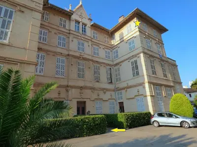 a building with a car parked in front of it at Le Zeus - Cannes Villa St Henri seafront unique 2bedrooms in Cannes