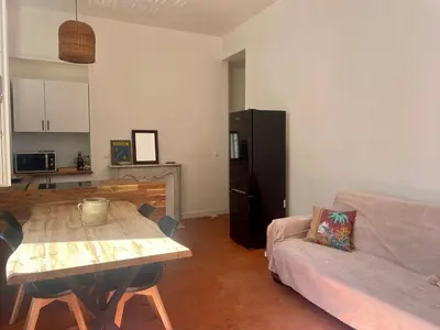 a living room with a table and a couch at Le Zeus - Cannes Villa St Henri seafront unique 2bedrooms in Cannes